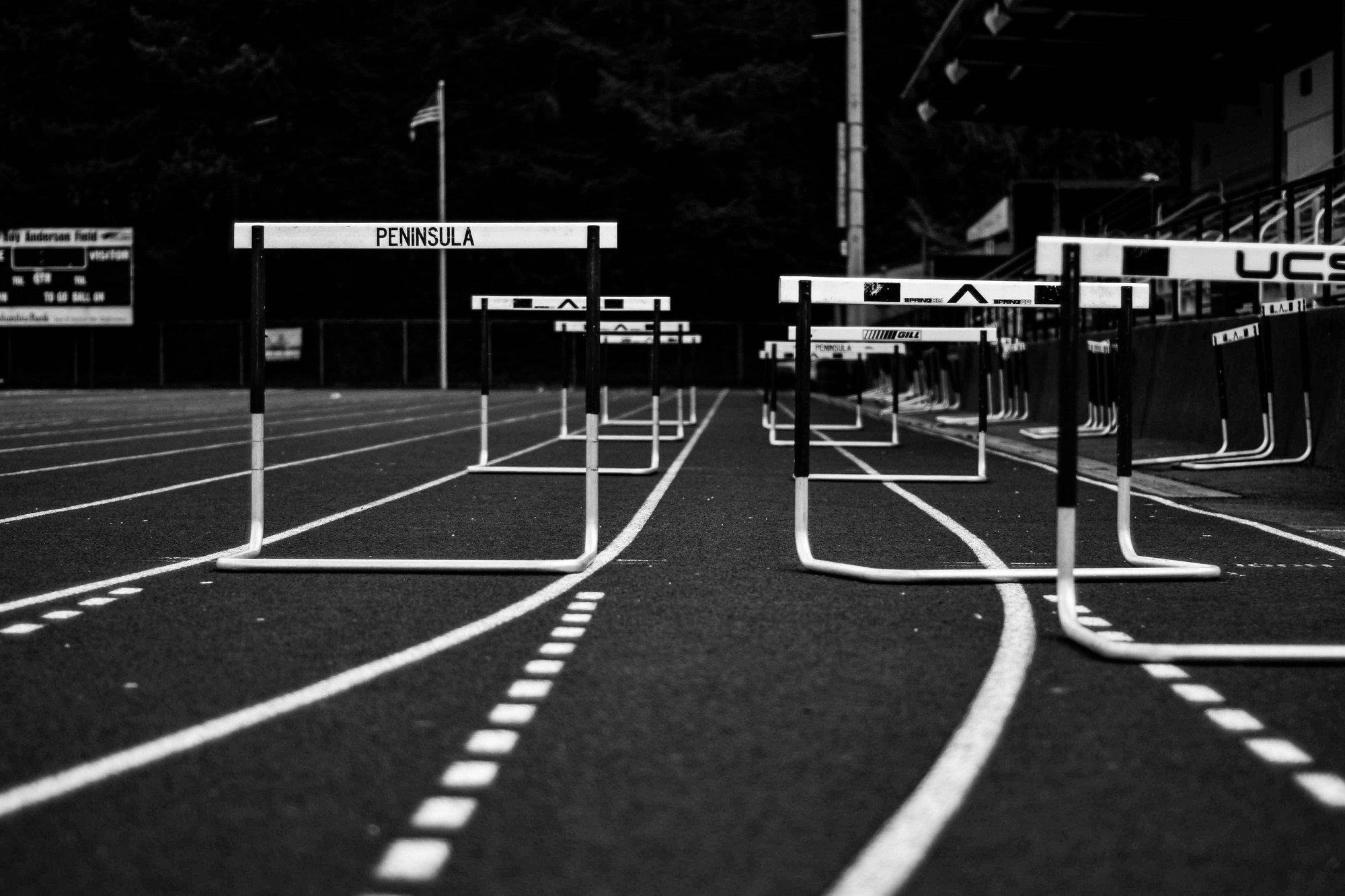 A hurdle on a running track, symbolizing the challenges BPOs must overcome to achieve growth and success.