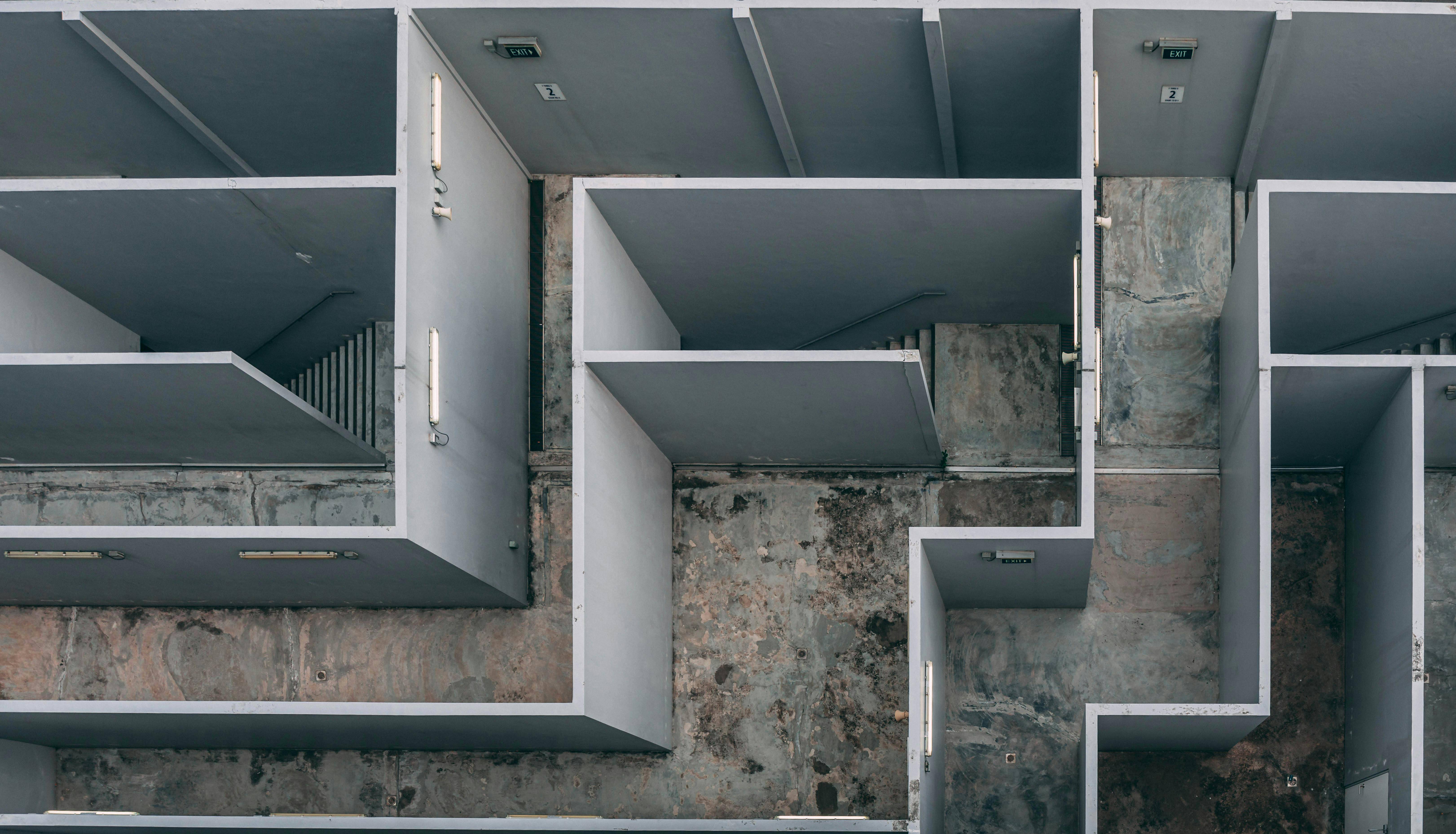 An aerial view of a concrete maze-like structure, representing navigating complexity and finding clarity in challenging situations.